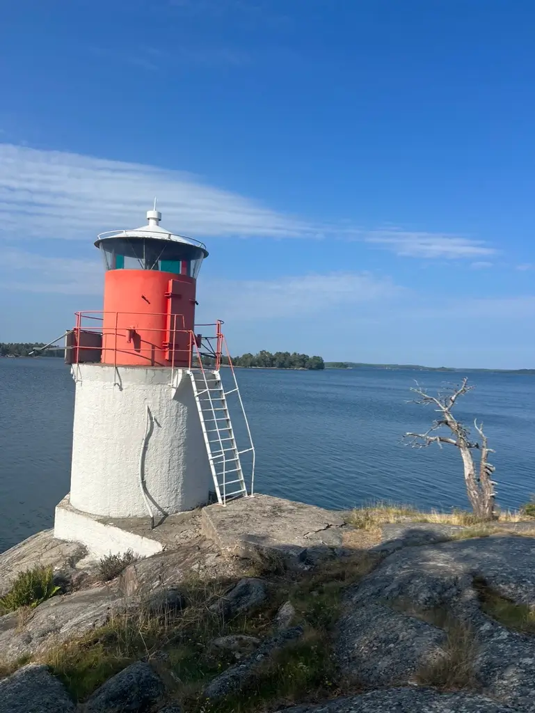 White and red lighthouse on Yxlan Island in the Stockholm Archipelago, Sweden.